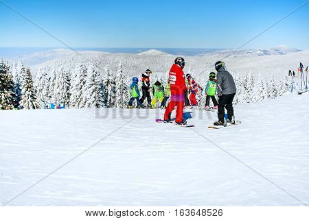 Kopaonik, Serbia - January 19, 2016: Ski resort Kopaonik, Serbia, ski slope, people skiing  and snowbarding down the hill, mountains view