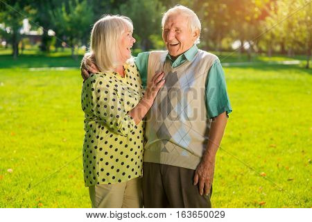 Laughter of senior couple. Man and woman outdoor. Good sense of humour. Mood shapes health.