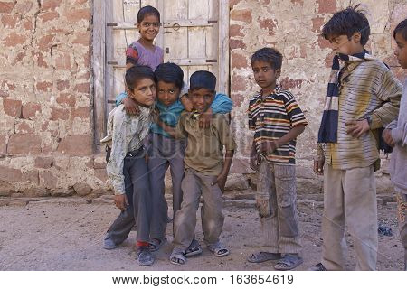 NAGAUR, RAJASTHAN, INDIA - FEBRUARY 14, 2008: Playful group of children in the backstreets of Nagaur in India.