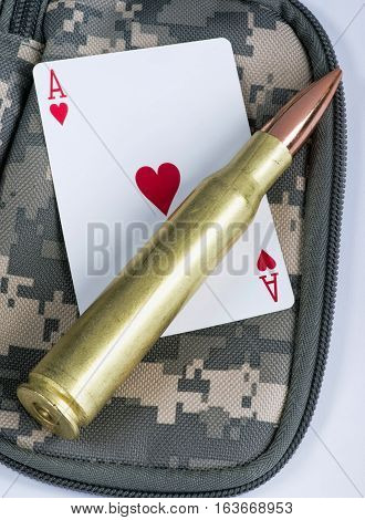 Ace of hearts and fifty caliber bullet.