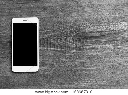 Moblie smart phone on wood table background