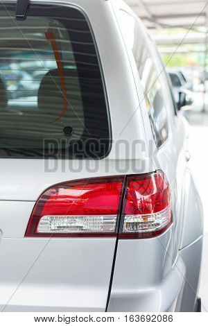 cars tail light beutiful.Detail of red tail light on silver color car