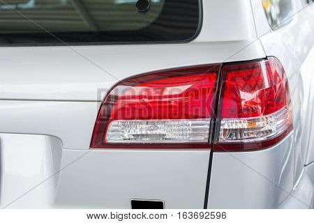 cars tail light beutiful.Detail of red tail light on silver color car