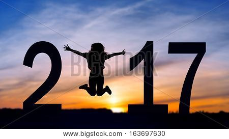 Silhouette young woman jumping on the sea and 2016 years while celebrating new EAP, 2016, happy girl. silhouette of girl at sunset, jumping on the background of sunset