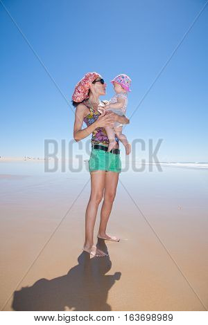 Mom And Baby At Beach