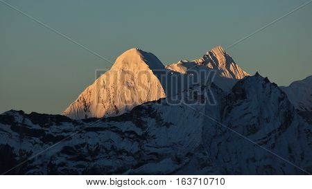 High mountains of the Himalayas bright lit by the first sunlight of the day. View from Chukhung Everest National Park.