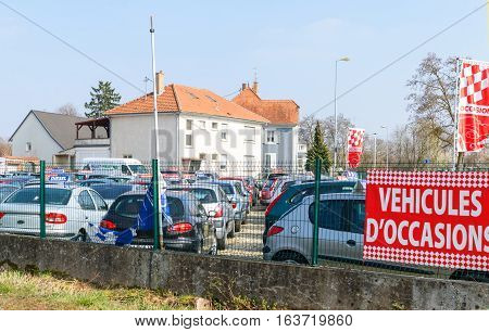 STRASBOURG FRANCE - MAR 20 2016: Vehicules d'Occasion translating as Used Cars garage outside the city of Strasbourg with large selection of French and German cars - Renault Peugeot Citroen Vw Ford