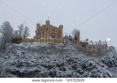 Fussen Germany - December 26 2014: view of Hohenschwangau Castle in Bavarian Alps in winter time on December 26 2014 near Fussen Germany.
