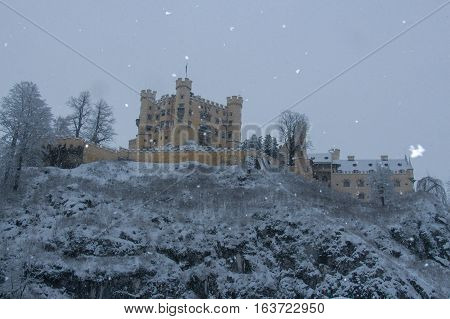 Fussen Germany - December 26 2014: view of Hohenschwangau Castle in Bavarian Alps in winter time on December 26 2014 near Fussen Germany.