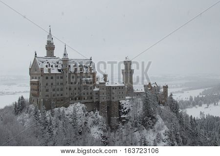 Fussen Germany - December 26 2014: view of the Neuschwanstein Castle in winter time on December 26 2014 near Fussen Germany.