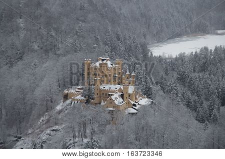 Fussen Germany - December 26 2014: view of Hohenschwangau Castle in Bavarian Alps in winter time on December 26 2014 near Fussen Germany.