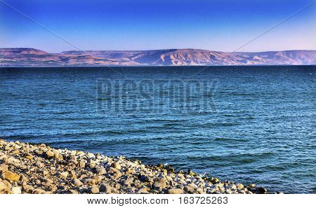 Sea of Galilee Capernum from Saint Peter's House Israel TFront of Saint Peter's House in Capernum with Church on Top of House. View from seaside outside Peter's House where Jesus Christ walked.