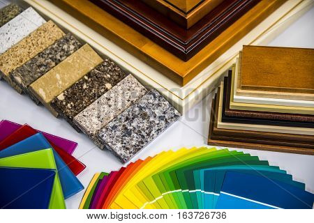 selection of kitchen interior material doors, cabinets, countertops, paint colors and glass samples