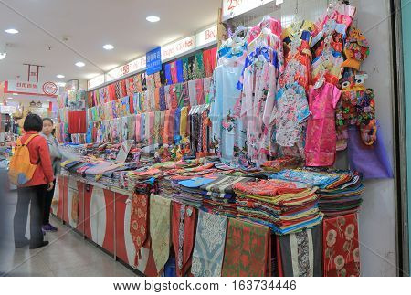 BEIJING CHINA - OCTOBER 26, 2016: Unidentified people visit Hong Qiao Pearl market in Beijing. Hong Qiao Pearl market famous for pearls but has wide range of souvenirs and toys.
