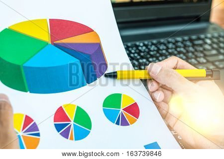 Business Workers Discussing Digital Graphs And Diagrams Indicating Progres