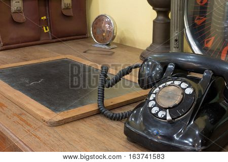 Black Antique Vintage Analog Telephone Dialling Or Scrolling Phone With Antique Clock And Business B