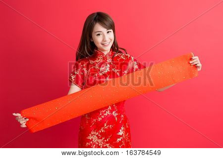 beauty woman wear cheongsam and show couplets with chinese new year