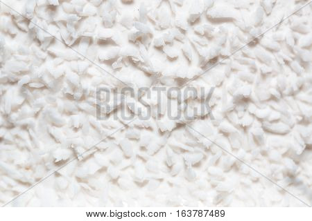 white coconut shavings on the cake. background and texture