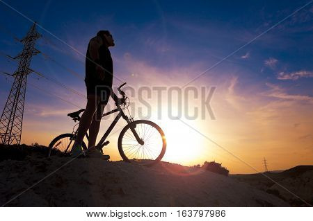 Extreme sports.Mountain bicycle and man.Life style outdoor extreme sport.Sport and healthy life.Mountain bike and landscape background