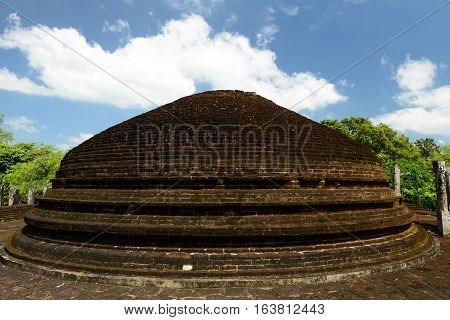 Polonnaruwa ruin was the second capital of Sri Lanka after the destruction of Polonnaruwa. The photograph is presenting Crematory Stupa at Alahana Parivena. Sri Lanka