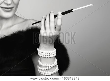 The Mouthpiece Is In The Hands Of Gorgeous Woman, A Beautiful Woman Smokes While