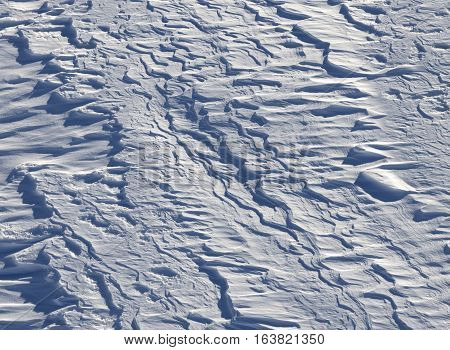 Off-piste after snowfall in ski resort at sun winter day. Natural background.