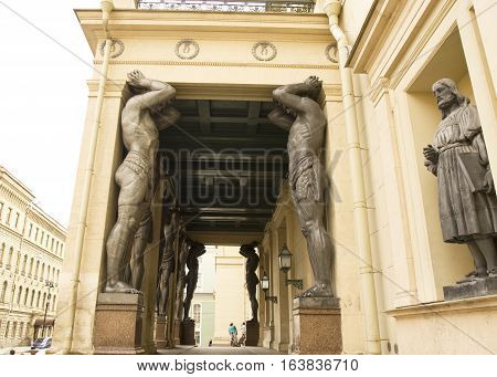 SAINT-PETERSBURG RUSSIA - JULY 14 2012: sculptures of Atlases near entrance of State Art museum Hermitage errected in 1848 year.