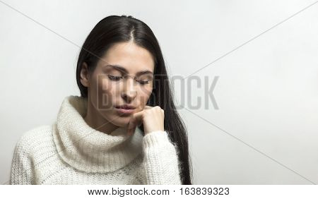 girl posing in the studio isolated on light grey background with copyspace