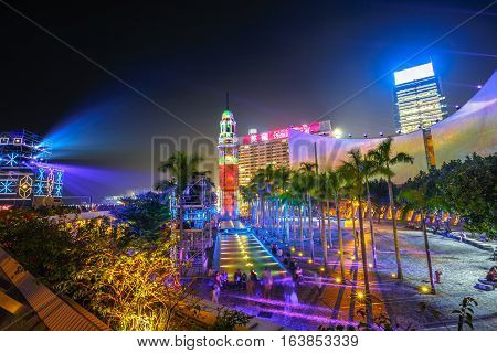 Hong Kong, China - December 5, 2016: the spectacular 3D light show at iconic buildings of Hong Kong Cultural Centre and Clock Tower. Victoria Harbour waterfront, Tsim Sha Tsui. Aerial view cityscape.