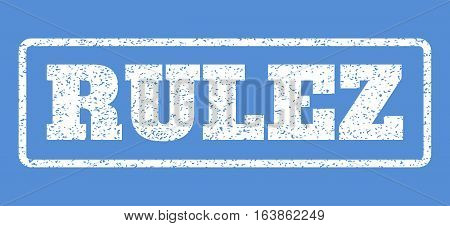 White rubber seal stamp with Rulez text. Vector caption inside rounded rectangular frame. Grunge design and scratched texture for watermark labels. Horisontal emblem on a blue background.