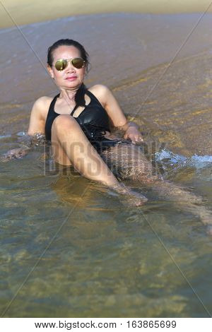 Lady relax sexy swimsuit in Ban Krut Beach at Prachuap Khirikhun Province Thailand
