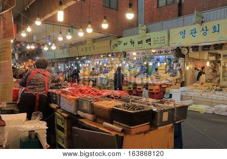 SEOUL SOUTH KOREA - OCTOBER 21, 2016: Unidentified people work at Gwangjang market. Gwangjang market is one of the oldest and largest traditional markets in South Korea with more than 5000 shops.