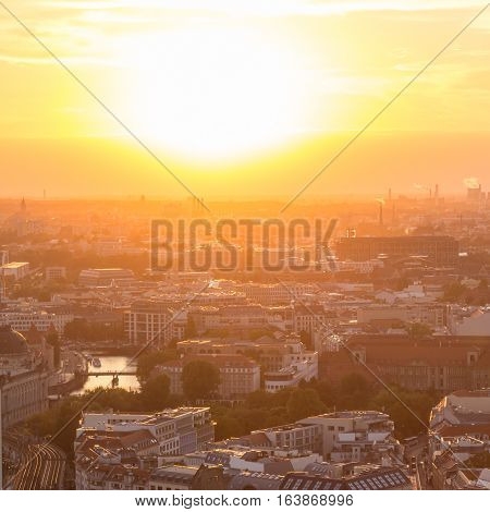 Beautiful panoramic aerial view over Berlin, Germany, in romantic colorful sunset.