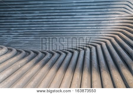 Metal tunnel made of rounded steel pipes.