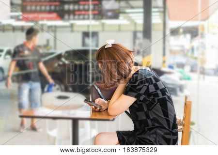Woman Using Smartphone Wait For Cleaning The Car