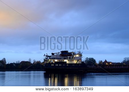 View of Neva River with cargo ship at evening in St.Petersburg Russia.