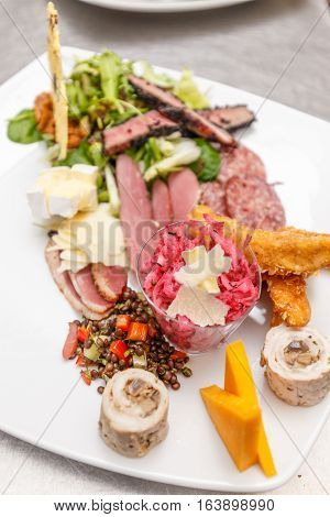 Appetizer served on a plate. Prepared by a professional chef.