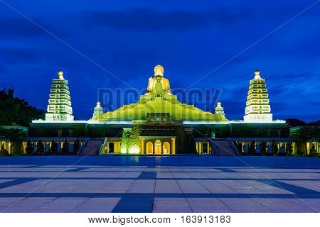 Night view of buddha statue and traditional architecture