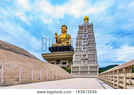 Buddha statue with cloudy sky in the evening