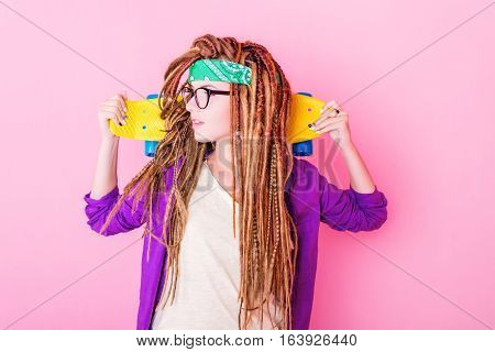 Portrait Of A Young Girl With Skateboard