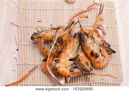 Burn Shrim And Seafood Sauce On Wooden Table.