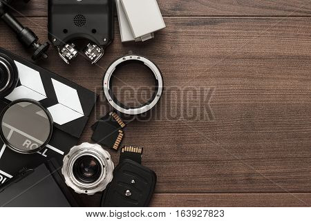 different video making equipment on brown wooden table