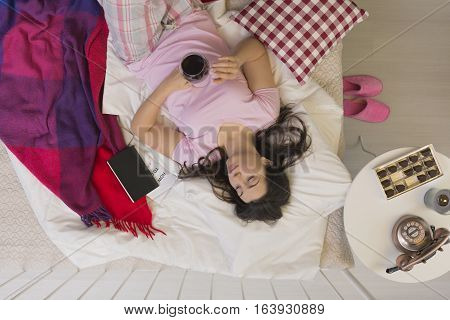 Woman Spending Evening In Bed