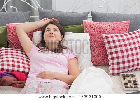 Happy Woman Relaxing In Bed