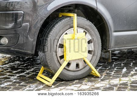 Car was locked with clamped vehicle wheel lock. Parking on forbidden place.