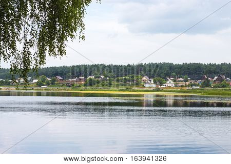 River Karakan the village of Zavyalovo Novosibirsk oblast Siberia Russia - July 7 2016: a view of the ancient Siberian village across the river