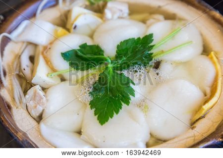 Traditional Shimabara Guzoni - Soup With Rice Cake And Seafood