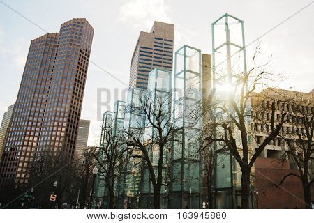 The New England Holocaust Memorial, Boston USA. six glass towers on the background of sky and city.
each tower symbolizes a different major extermination camp (Majdanek, Chełmno, Sobibor, Treblinka, Bełżec, and Auschwitz-Birkenau)