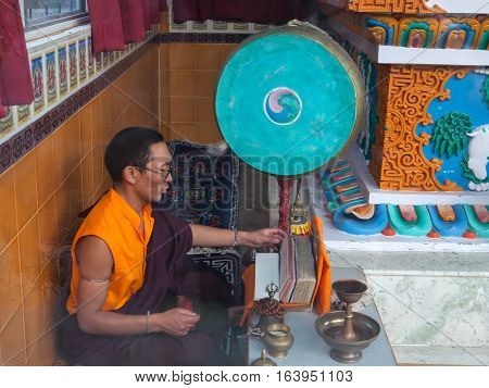 REWALSAR, INDIA. 2 June 2009:  Daily lifestyle of the monks in a Buddhist monastery.  Closeup portrait of a Buddhist monk. Rewalsar, district Mandi, Himachal Pradesh, district of Kangra, India.