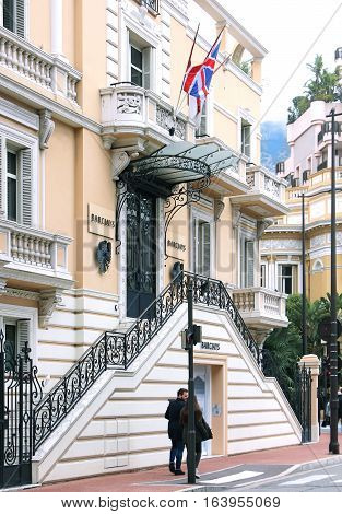 MONTE CARLO MONACO - February 02: Branch of Barclays bank building with people on the sidewalk in Monte Carlo Monaco - February 02 2016; Barclays is a British multinational banking and financial services company with branches in many countries.